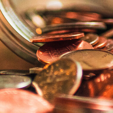 Coins falling out of jar