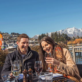 Couple al fresco dining on the Steamer Wharf, Queenstown