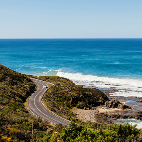 A car driving down the great ocean road in Wongara, Australia