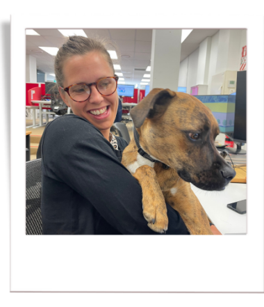 Helena in the office with her dog Malcom