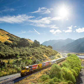 TranzAlpine train crossing South Island NZ river