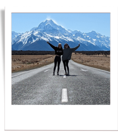 Hannah & Louise standing in front of Aoraki, Mount Cook