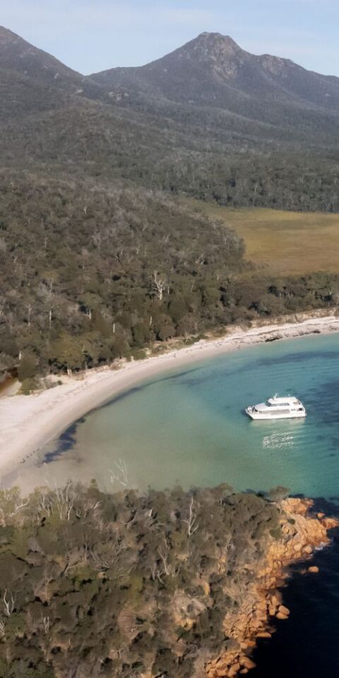 Beach and sea in front of mountains