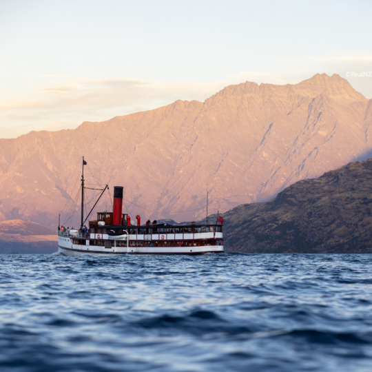 Queenstown TSS Earnslaw at sunset with remarkables