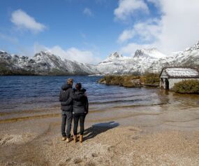 Couple looking out over the lake at cradle mountain