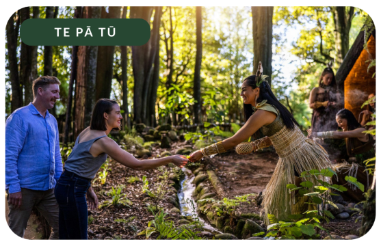 Travellers receiving a traditional gift Te Pa Tu Maori Culture Experience in New Zealand