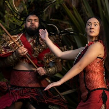 Maori man and woman in traditional clothing