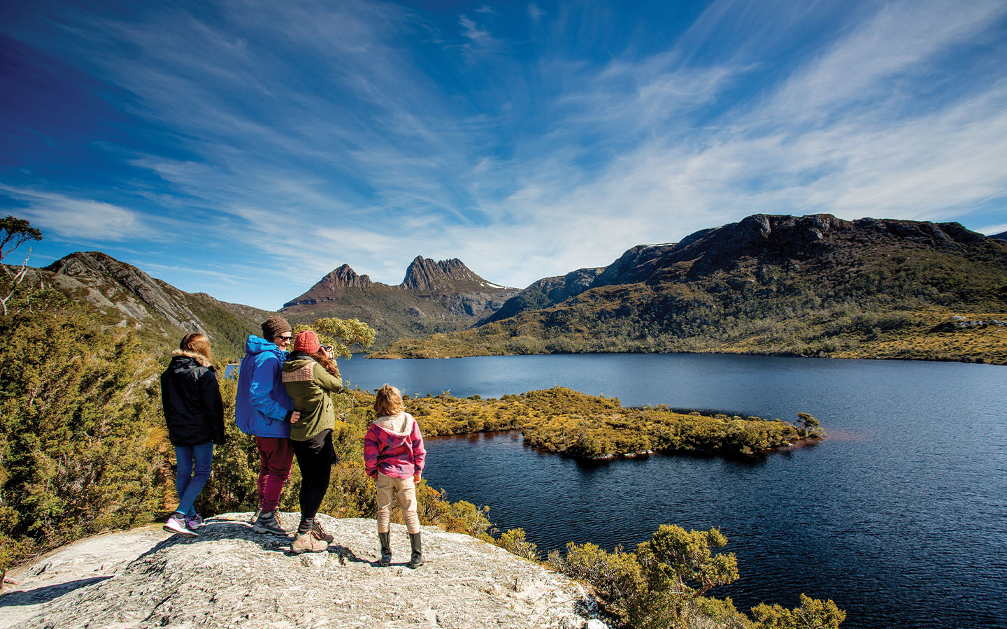 A family hiking around Lake St Clair at Cradle Mountain National Park