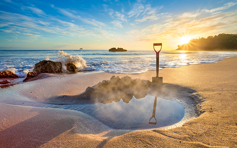 Sink into a pool as the sun sets over Hot Water Beach Sink into a pool as the sun sets over Hot Water Beach
