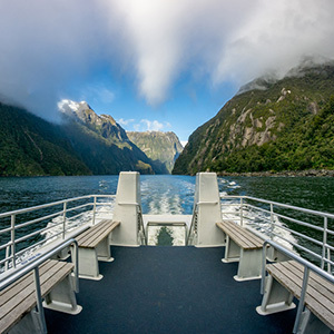 Boat cruising spectacular Milford Sound, New Zealand