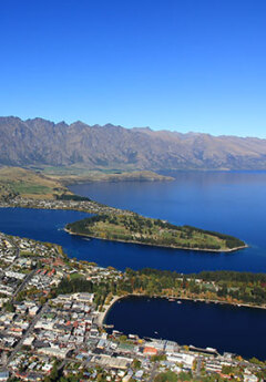 Aerial view of Lake Wakatipu and Queenstown on a sunny day