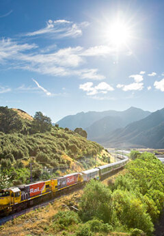 TranzAlpine heading towards the mountians on a sunny day