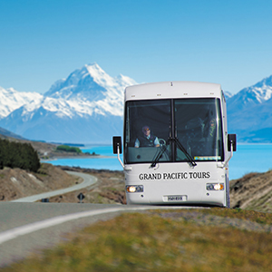 Image of a coach with Mount Cook National Park in the background
