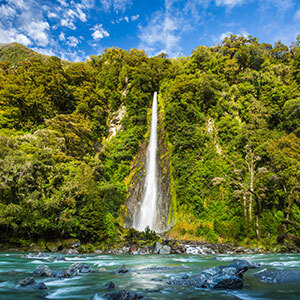 Image of Thunder Creek Falls in the Mount Aspiring National Park on a sunny day