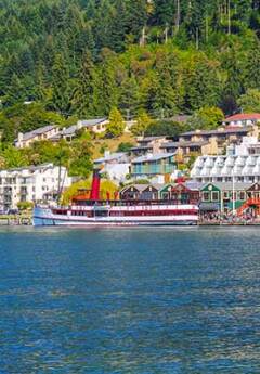 TSS Earnslaw cruising Lake Wakatipu and Queenstown waterfront