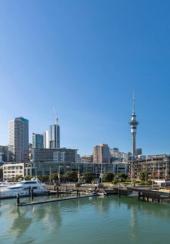 View from the water of the Auckland Skytower and Viaduct Harbour