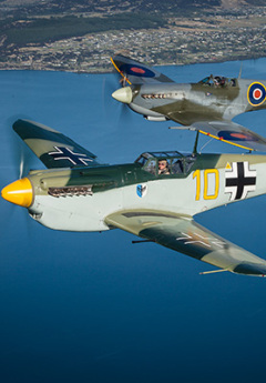 Old-school planes flying over Wanaka during Warbirds over Wanaka