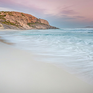 The sunset pink skies reflecting over the blue waters of Esperance