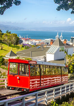 Red cable car heading down the hill in Wellington