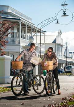 A couple cycling in a wine region of Martinborough