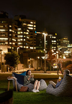 Couple enjoying a drink in Wellington in the evening