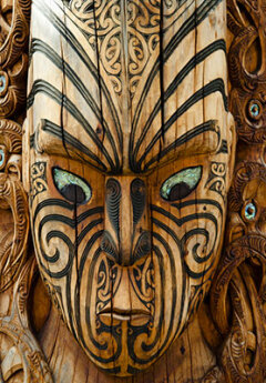 Image of a wooden Maori mask in Rotorua