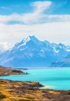 View of Mount Cook NAtional Park and crystal clear waters of Lake Pukaki