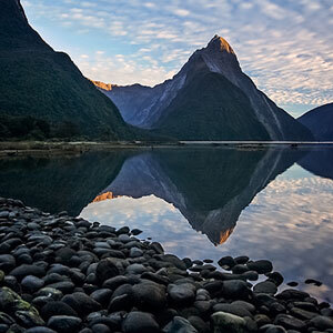 Evening reflections on the water at Milford Sound