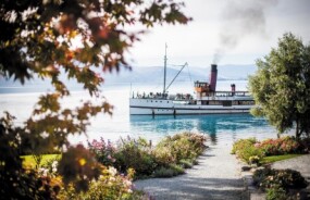 TSS Earnslaw sailing away from Walter Peak Station