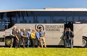 GP travellers stood outside the Signature coach