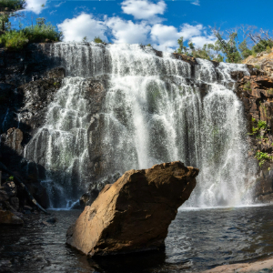 Water flowing from rocks into a pool of water