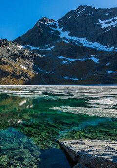 View of crystal clear water of Lake Alta, The Remarkables