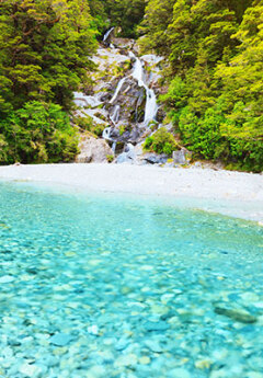 Crystal clear water in Faitail Falls near Haast Pass, New Zealand