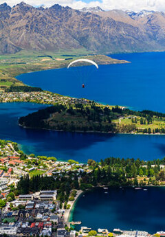 Paraglider over Queenstown and Lake Wakatipu