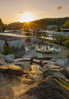 Hell's Gate Geothermal Reserve and Mud Spa at golden hour under the sunset.