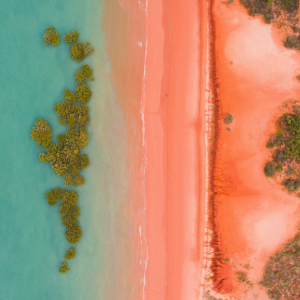 Aerial View of Red Sand and Turquoise Sea