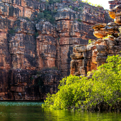 ocean below with large cliffs towering