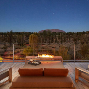 Day bed with fire and Uluru in the back