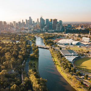 River with city landscape and park area