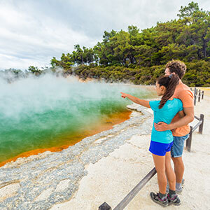A couple is exploring a Champagne Pool in Rotorua