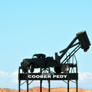 Coober Pedy Truck statue with desert hills in the background