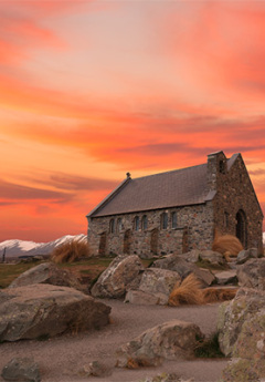 Church of Old Good Shepherd next to Lake Tekapo during sunset