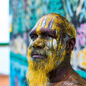 Portrait of indigenous Tiwi man with traditional face paint.