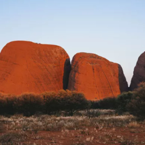 Kata Tjuta's large red rock domes rise above the Australian outback.