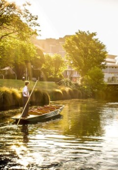 A man paddles a gondola boat down the Avon River in Christchurch.