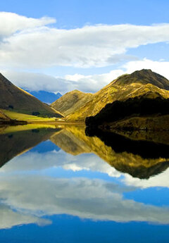 View of Moke lake and beautiful reflections on the lake surfarce near Queenstown