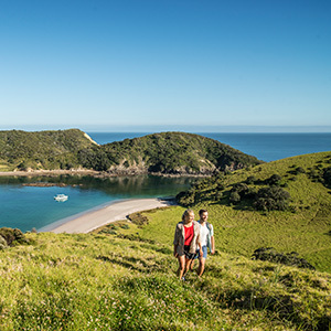 Couple walking in the Bay of Islands