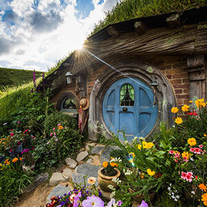 Image of Hobbit's blue doors and colourful flowers