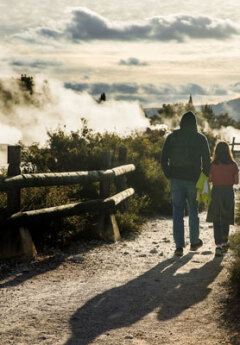 Father and daughter walking in georthermal area