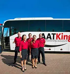 AAT Kings crew outside their tour bus